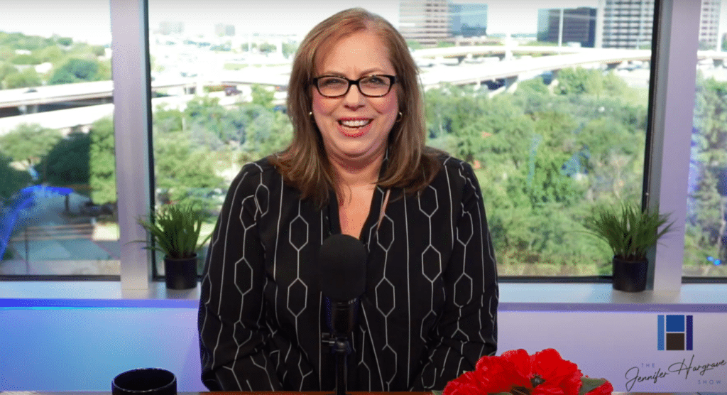 Woman speaking into microphone in studio setting