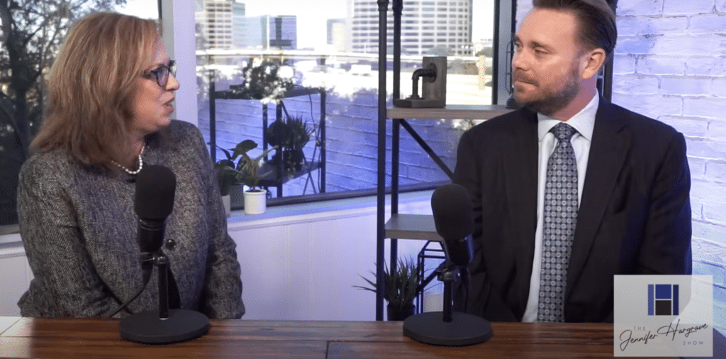 Two professionals speaking on a podcast set