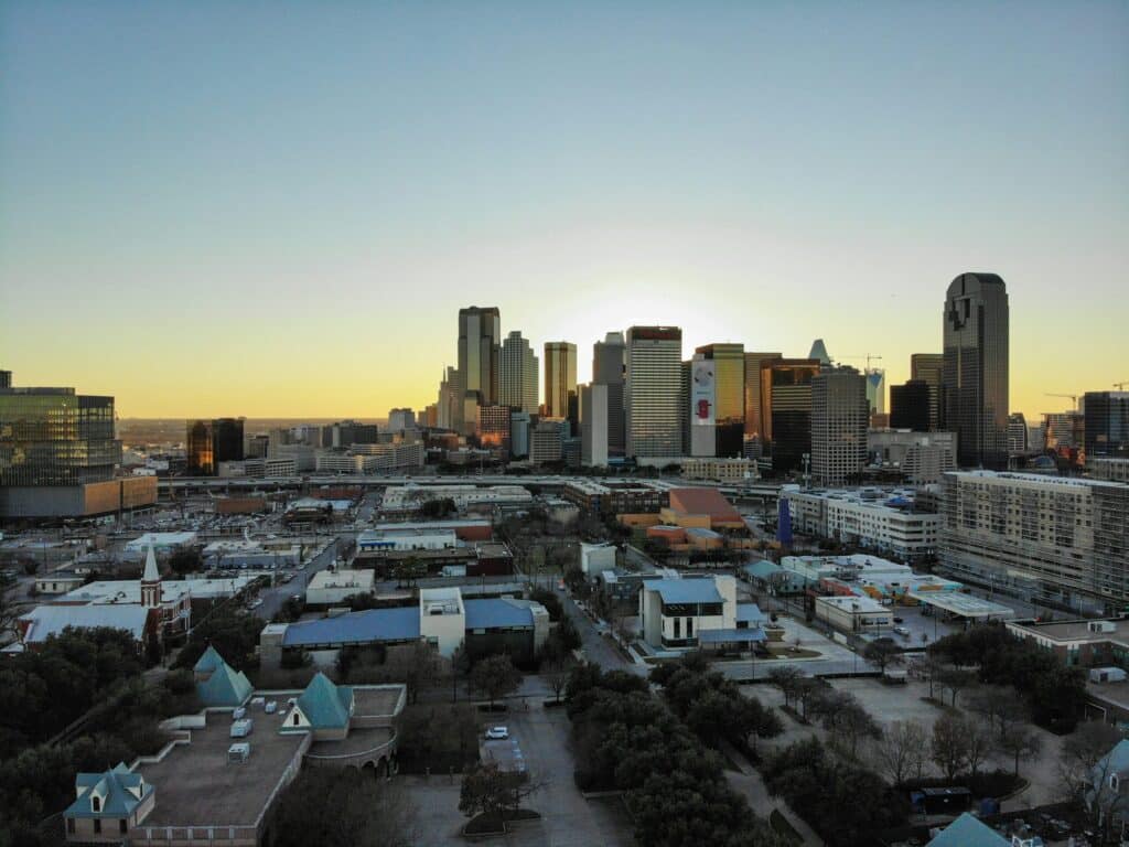 Downtown city skyline at sunset with skyscrapers