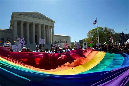 Large rainbow pride flag in front of Supreme Court