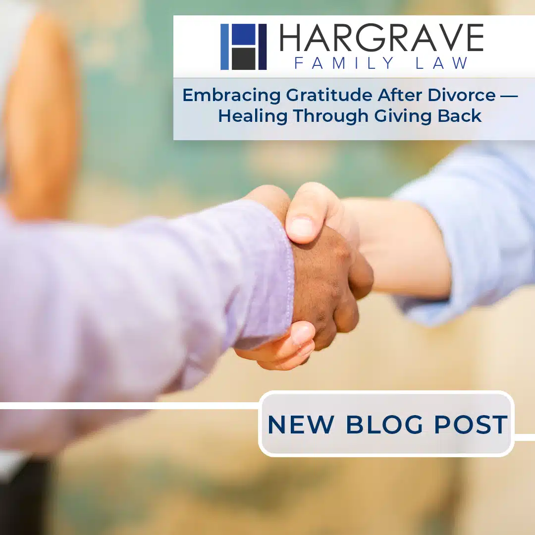 Two people shaking hands with law firm banner