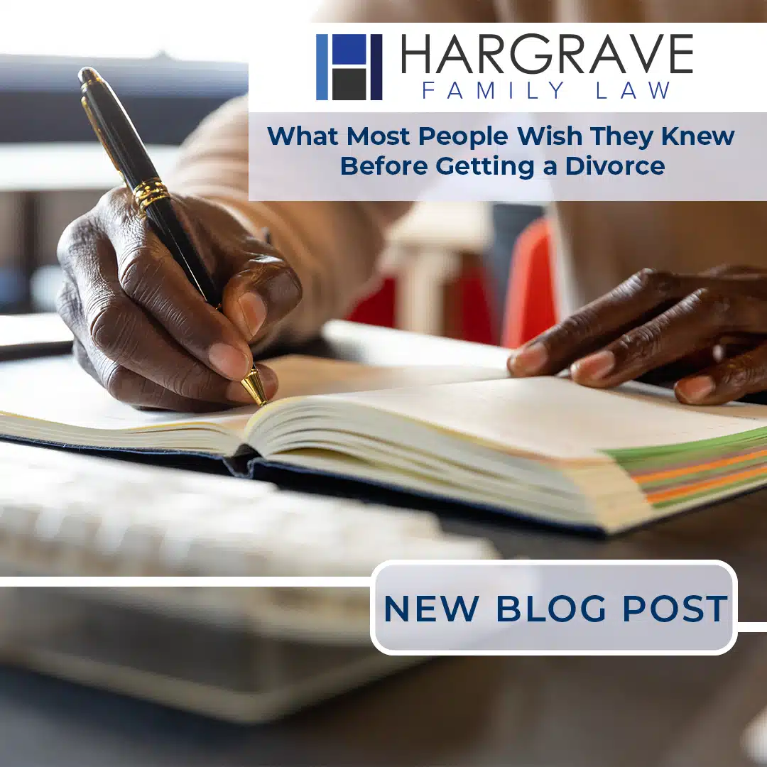 Person writing in notebook with divorce law blog overlay