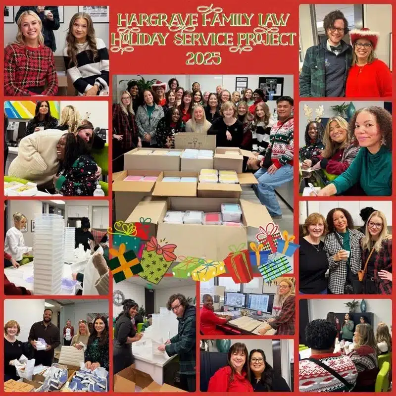 Team packing holiday donation boxes in office