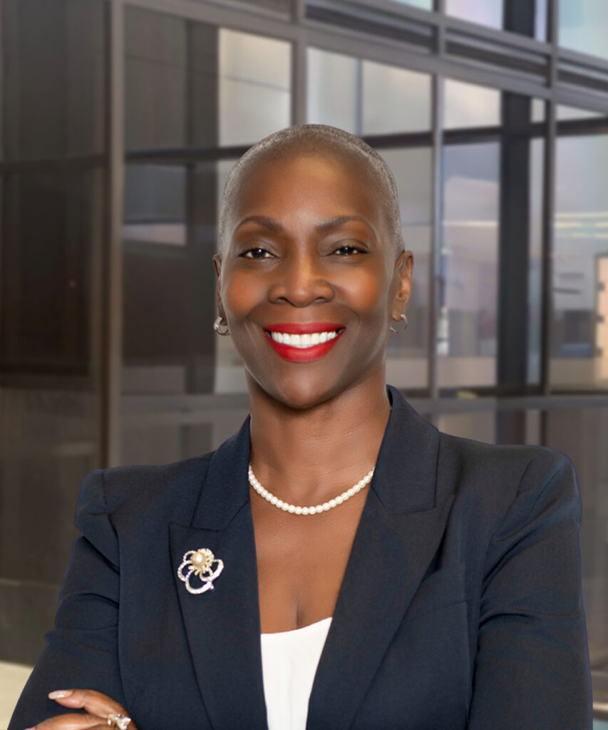 Smiling businesswoman in navy blazer standing in office