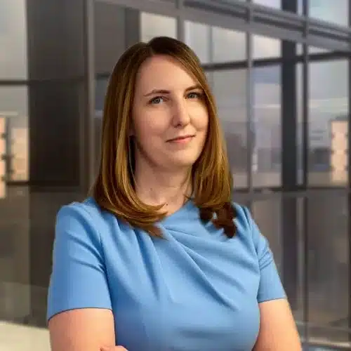 Professional woman in blue dress in office