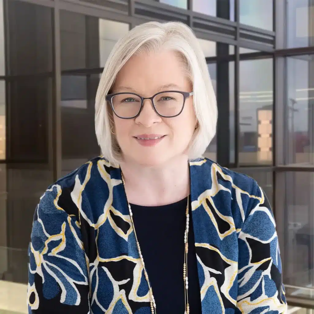 Professional woman with glasses in modern office