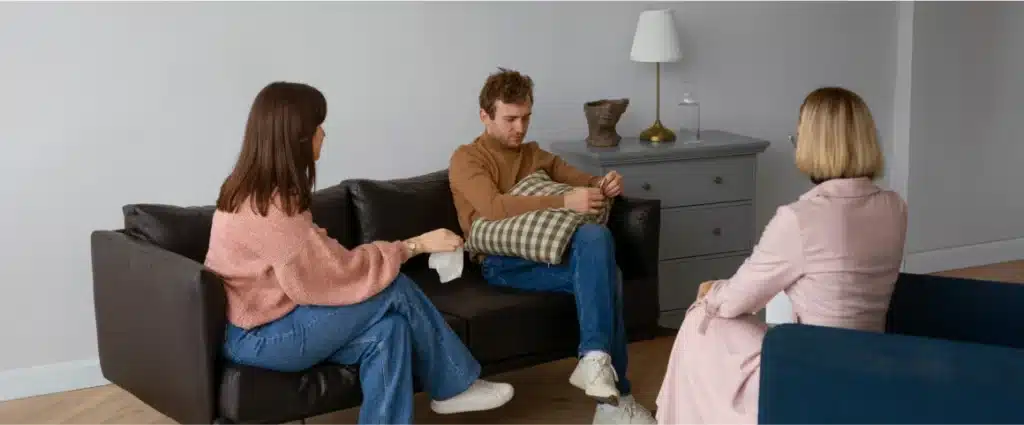 Couple in therapy session with counselor