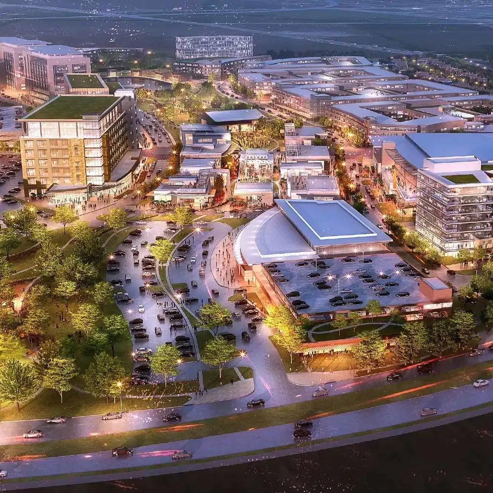 Aerial view of illuminated mixed-use urban development