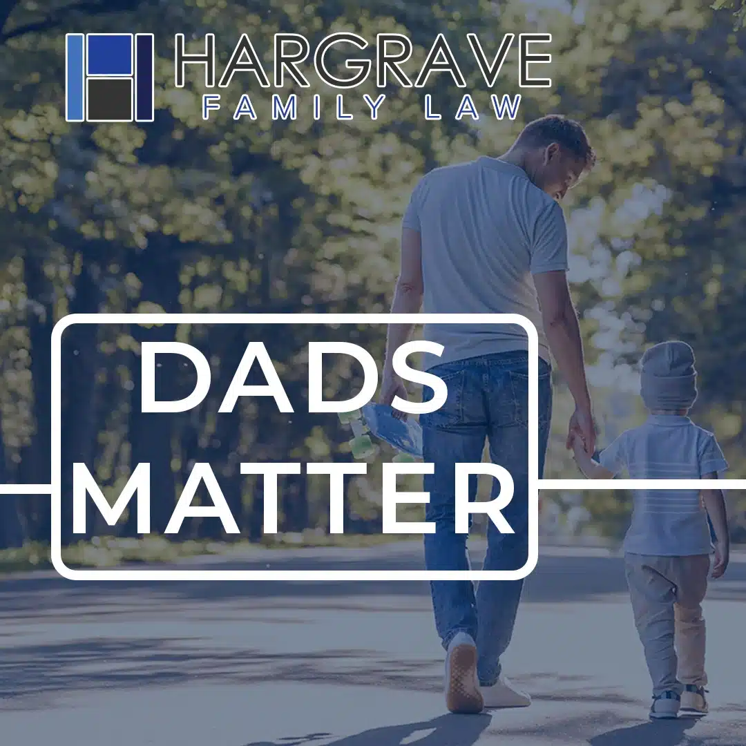 Father and child walking holding hands outdoors