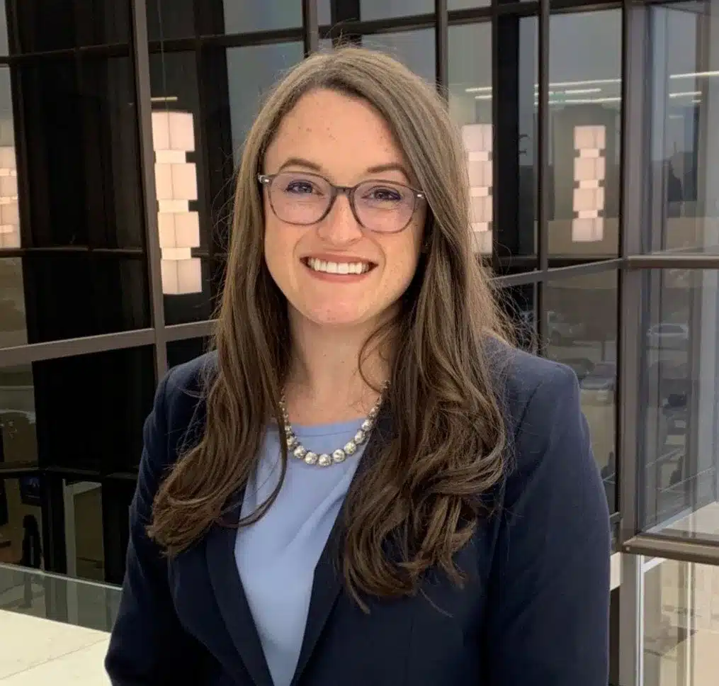 Smiling professional woman in office building lobby