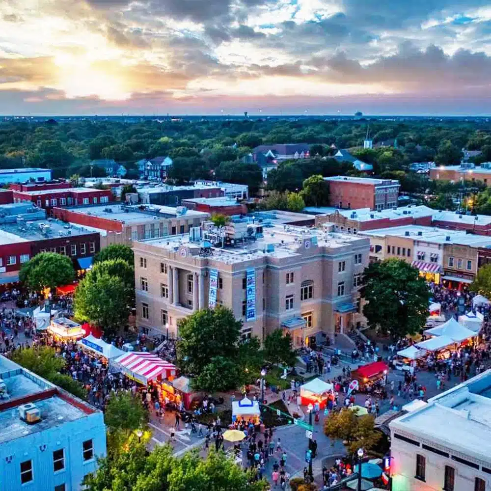 Downtown street festival at sunset aerial view