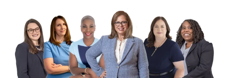Six professional women posing in business attire