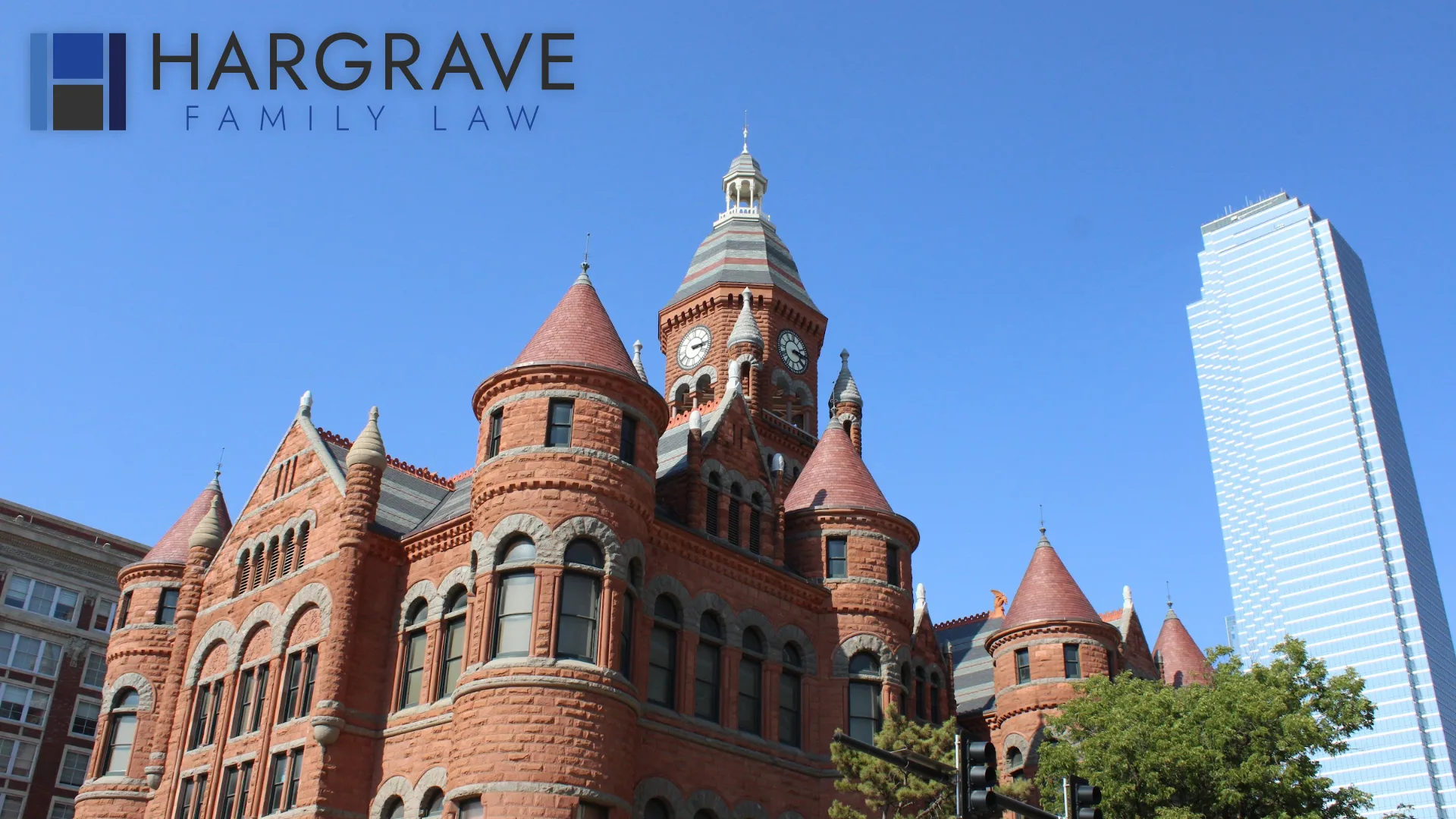 The Old Red Courthouse beside a modern glass tower in downtown Dallas, where Hargrave Family Law represents local families.