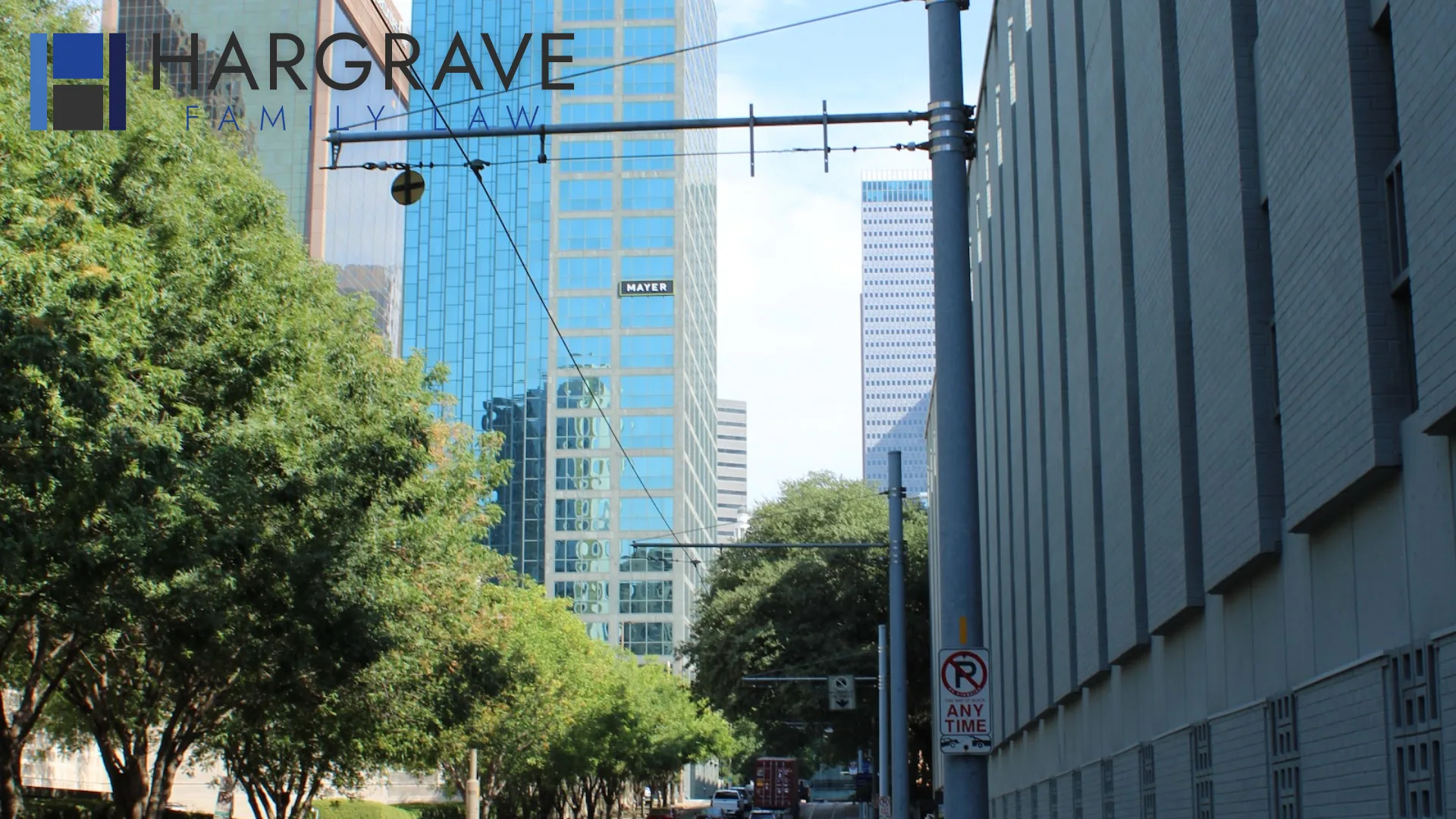 Glass office towers lining a downtown Dallas street in Texas, where spouses file contested, uncontested and high-asset divorces.