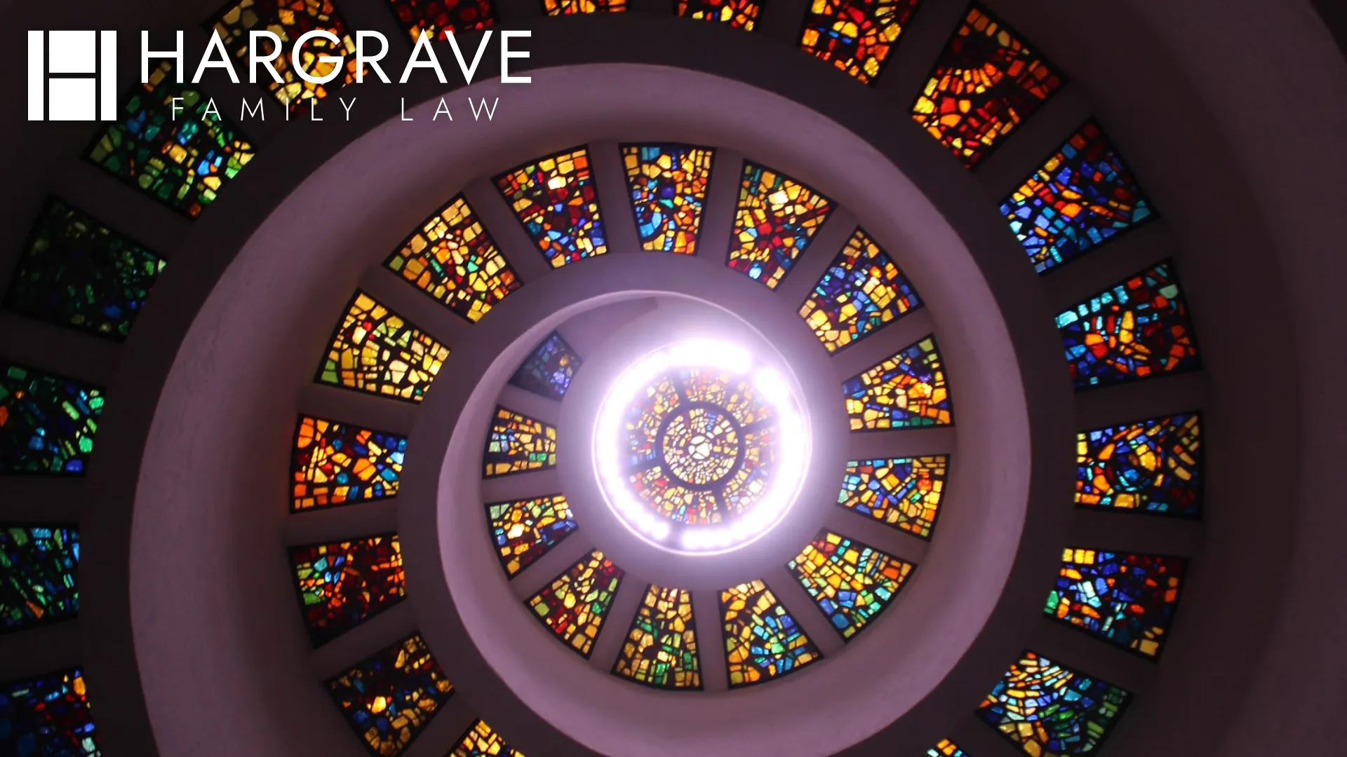 The spiral stained glass ceiling of the Thanks-Giving Chapel in Dallas, Texas, where engaged couples prepare prenuptial agreements before marriage.